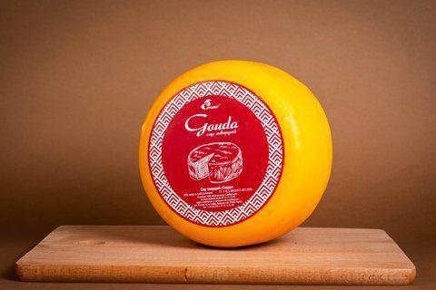 Сир твердий "Гауда" парафін 50% жиру круг 720 фото
